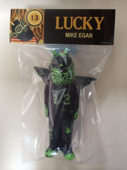 Lucky - Green figure by Mike Egan, produced by Dke Toys. Packaging.