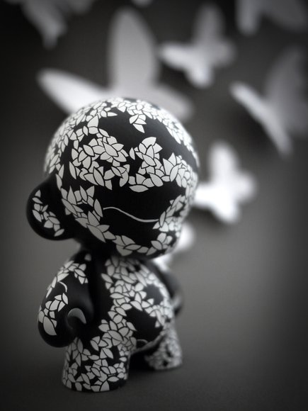 Black and White Jungle Munny figure by David Stevenson, produced by Kidrobot. Side view.