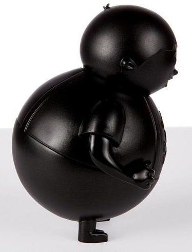 Black Big Kid figure by Johnny Cupcakes, produced by Johnny Cupcakes. Side view.