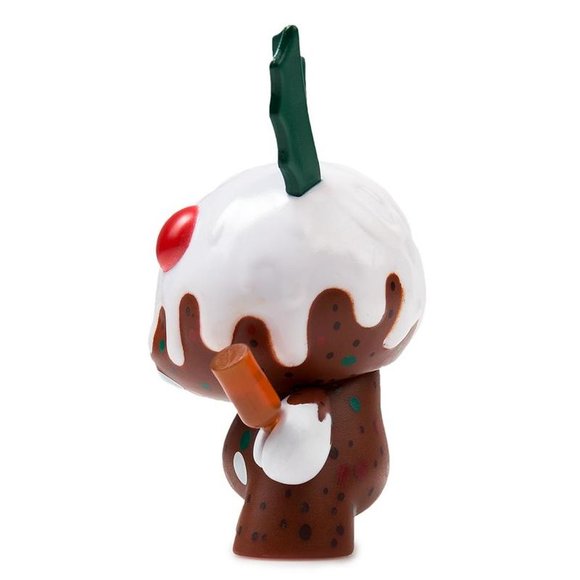 Christmas Pudding figure by Kronk, produced by Kidrobot. Side view.