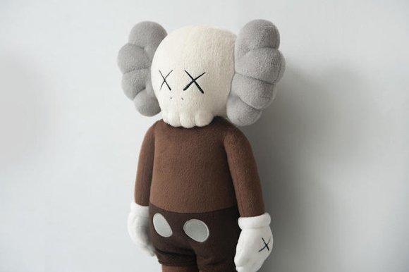 Companion Plush figure by Kaws, produced by Allrightsreserved. Side view.