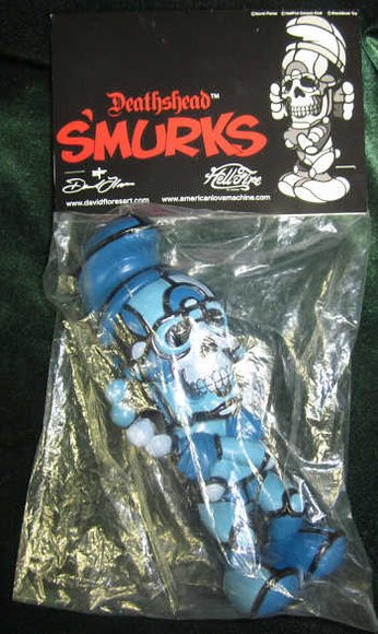 Deathead Smurk Blue Hue figure by David Flores X Hellfire Canyon Club, produced by Blackbook Toy. Packaging.