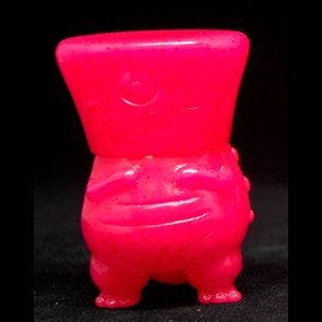 Glitter Pink Wedgehead figure by David Horvath, produced by Toy Art Gallery. Front view.