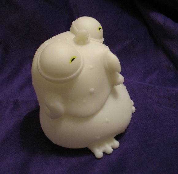 Glow-in-the-Dark Chog figure by John Layman X Rob Guillory, produced by Skeleton Crew Studio Llc. Side view.