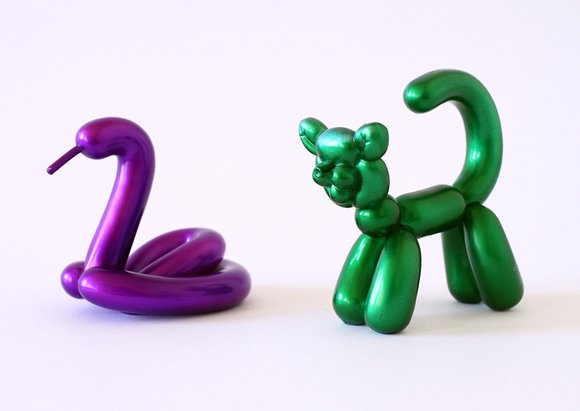 Green Cat figure, produced by Kidrobot. Side view.