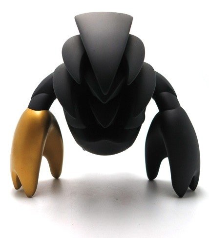 Locks - Black and Gold figure by Mark Landwehr, produced by Coarsetoys. Back view.