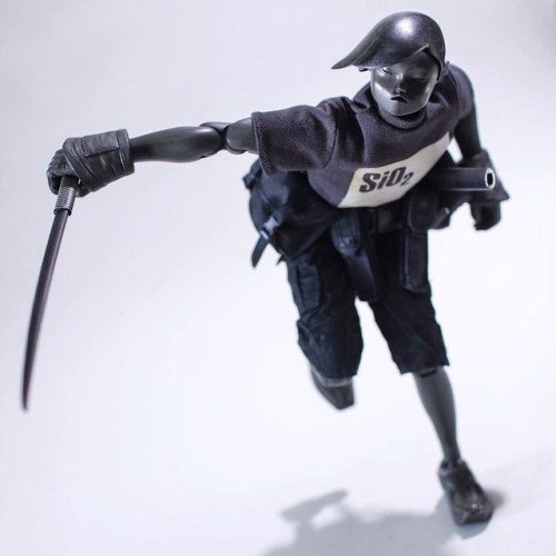 Obsidian TK figure by Ashley Wood, produced by Threea. Front view.