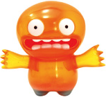 Orange Chupacabra figure by David Horvath, produced by Wonderwall. Front view.