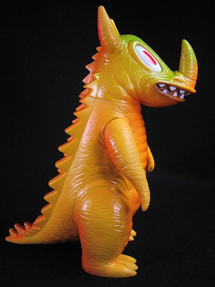 Orange Gama-Go Gamagon figure by Tim Biskup, produced by Gargamel. Side view.