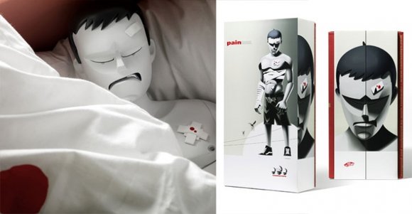 Pain 1:3 figure by Mark Landwehr, produced by Coarsetoys. Packaging.