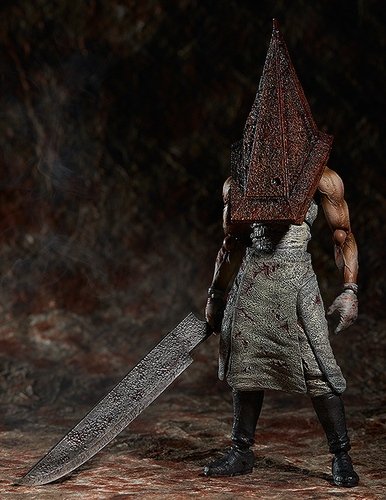 Red Pyramid Thing figure, produced by Freeing. Front view.