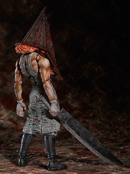 Red Pyramid Thing figure, produced by Freeing. Back view.