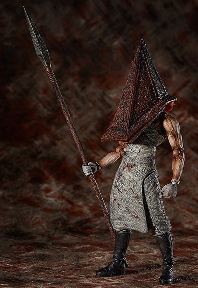 Red Pyramid Thing figure, produced by Freeing. Side view.