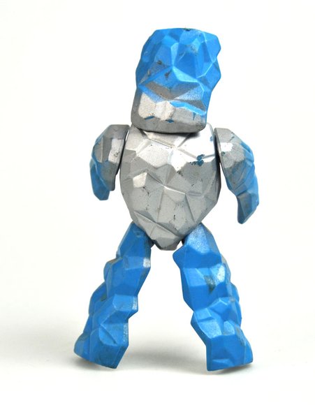 Rokkon figure, produced by Mattel. Back view.