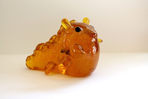 Sea Banana - Trapped Amber figure by Sawdust Bear. Side view.