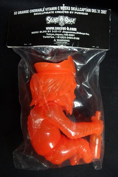 SkullCaptain - 52 Orange Chewable Vitamin C Weeks figure by Pushead, produced by Secret Base. Packaging.