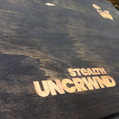 Stealth UNCRWND figure by Angry Woebots, produced by Angry Woebots X Silent Stage. Packaging.