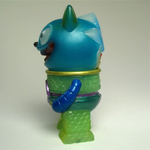 Super Puncher - Clear Neon Blue, Neon Green figure by Naoya Ikeda. Side view.