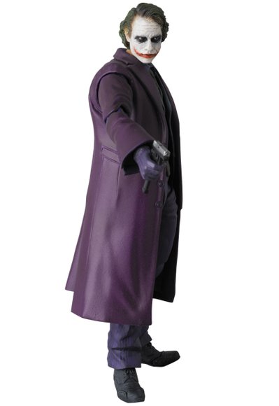 The Joker figure by Dc Comics, produced by Medicom Toy. Side view.