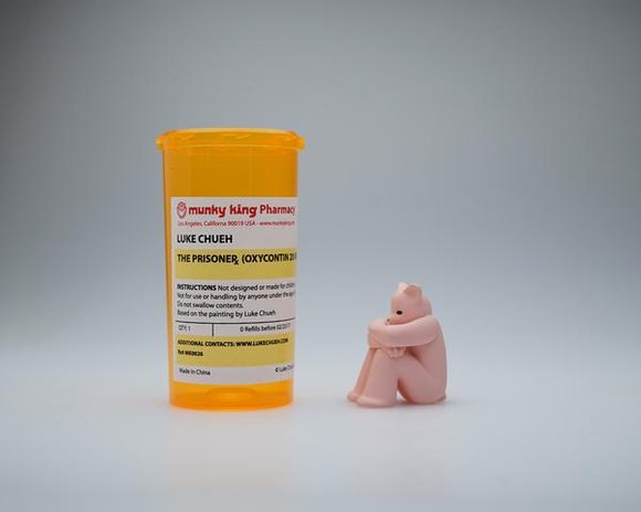 The Prisoner - Oxycontin figure by Luke Chueh, produced by Munky King. Packaging.