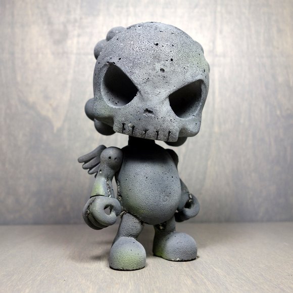 The Skullhead Blank - Cement figure by Huck Gee. None.
