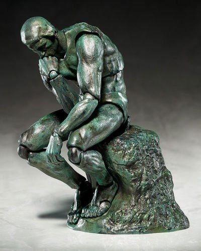 The Thinker figure, produced by Freeing. Side view.