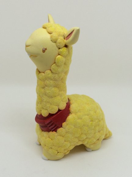 Tina The Lama figure by Okkle, produced by Chima Group. Side view.