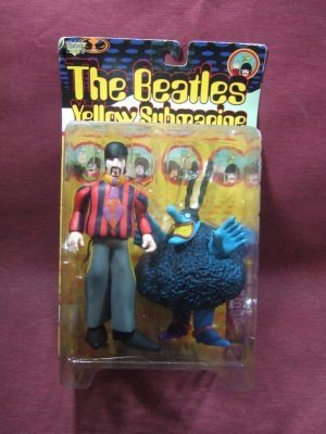 Ringo Starr with Blue Meanie figure by Heinz Edelmann, produced by Mcfarlane Toys. Front view.