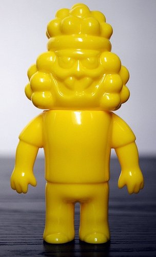 Hollis Price Unpainted Yellow figure by Le Merde, produced by Super7. Front view.