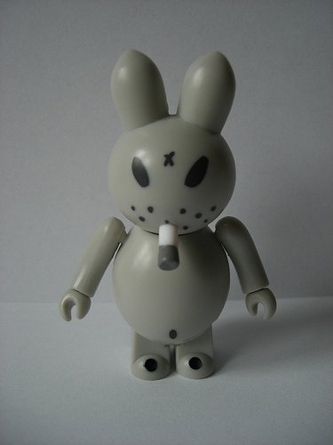 Smorkin Bunny - Grey figure by Frank Kozik, produced by Medicom Toy. Front view.