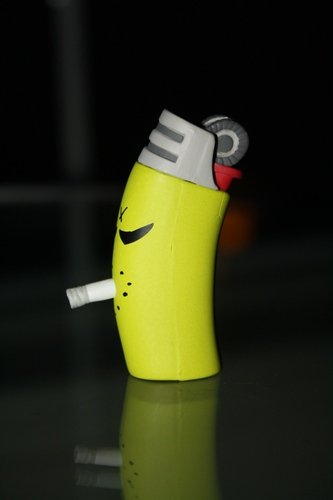 Monger Green Lighter  figure by Frank Kozik, produced by Kidrobot. Front view.