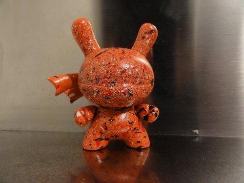 Splattered figure by Eechone, produced by Kidrobot. Front view.