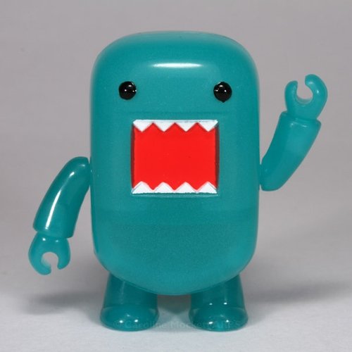 Teal GID Domo Qee figure by Dark Horse Comics, produced by Toy2R. Front view.