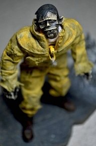 classic yellow zomb figure by Ashley Wood, produced by Threea. Front view.