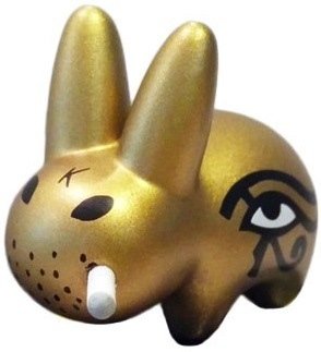 Eye of Horus - Gold figure by Frank Kozik, produced by Kidrobot. Front view.