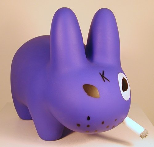 Smorkin Labbit - Dark Purple figure by Frank Kozik, produced by Kidrobot. Front view.