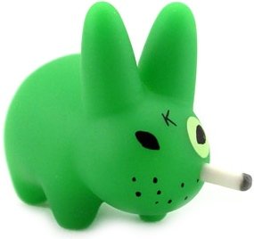 Smorkin Labbit - Florescent Green figure by Frank Kozik, produced by Kidrobot. Front view.