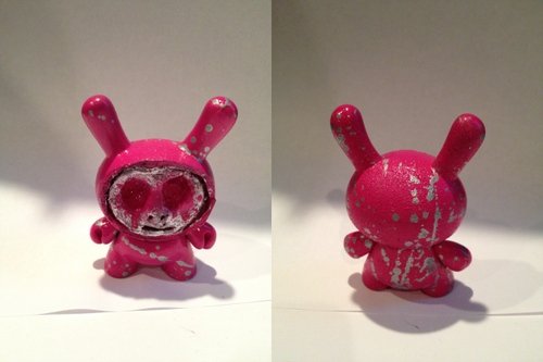 Unmasked figure by Quinn Humlicek, produced by Kidrobot. Front view.