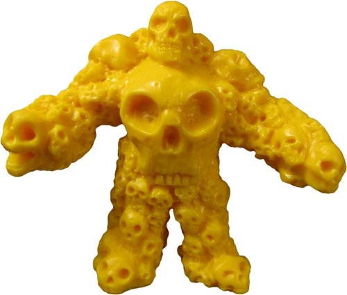 Multiskull - Yellow figure by Monsterforge, produced by October Toys. Front view.