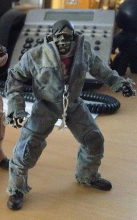 grey fodder zomb figure by Ashley Wood, produced by Threea. Front view.