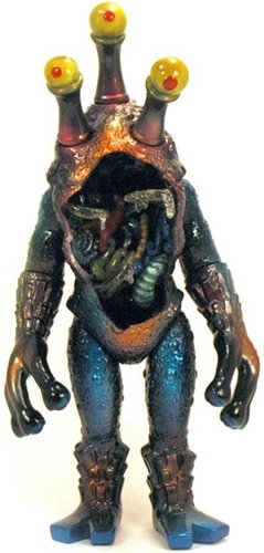 Gold and Blue with Guts and Red Eyes  figure by Mark Nagata. Front view.