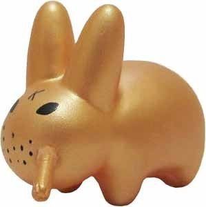 Smorkin Labbit Series 1 - Gold Labbit (Chase) figure by Frank Kozik, produced by Kidrobot. Front view.