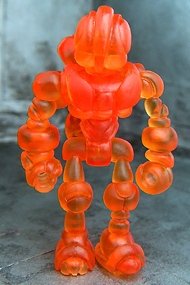 Buildman Gendrone Clear Orange figure, produced by Onell Design. Front view.