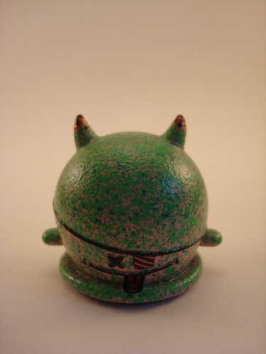 Radioactive Strawberry GID Buff figure by Brandon Morrow, produced by Mindstyle. Front view.
