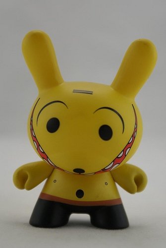 Grinning Yellow figure by Dalek, produced by Kidrobot. Front view.