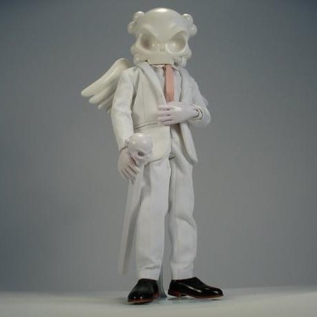 Jill Sander figure by Huck Gee, produced by Kidrobot X Barneys New York. Front view.