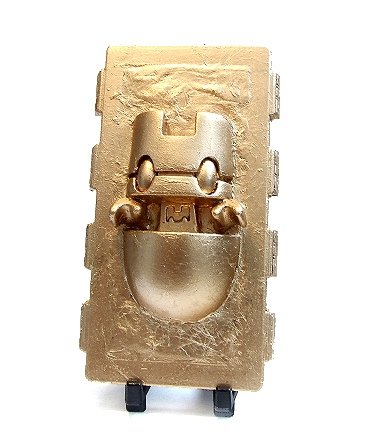 Cuppa Carbonite: Tea Leaf (gold leaf) figure by Dms. Front view.