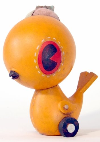 Orange Bird figure by Kathie Olivas. Front view.