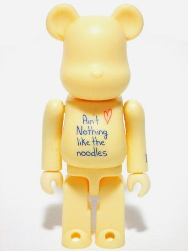 Be@rbrick 100% - noodles cream butter figure, produced by Medicom Toy. Front view.