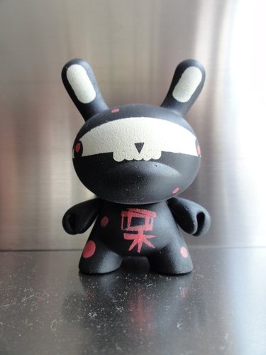 Candy ninja figure by Squidnik, produced by Kidrobot. Front view.